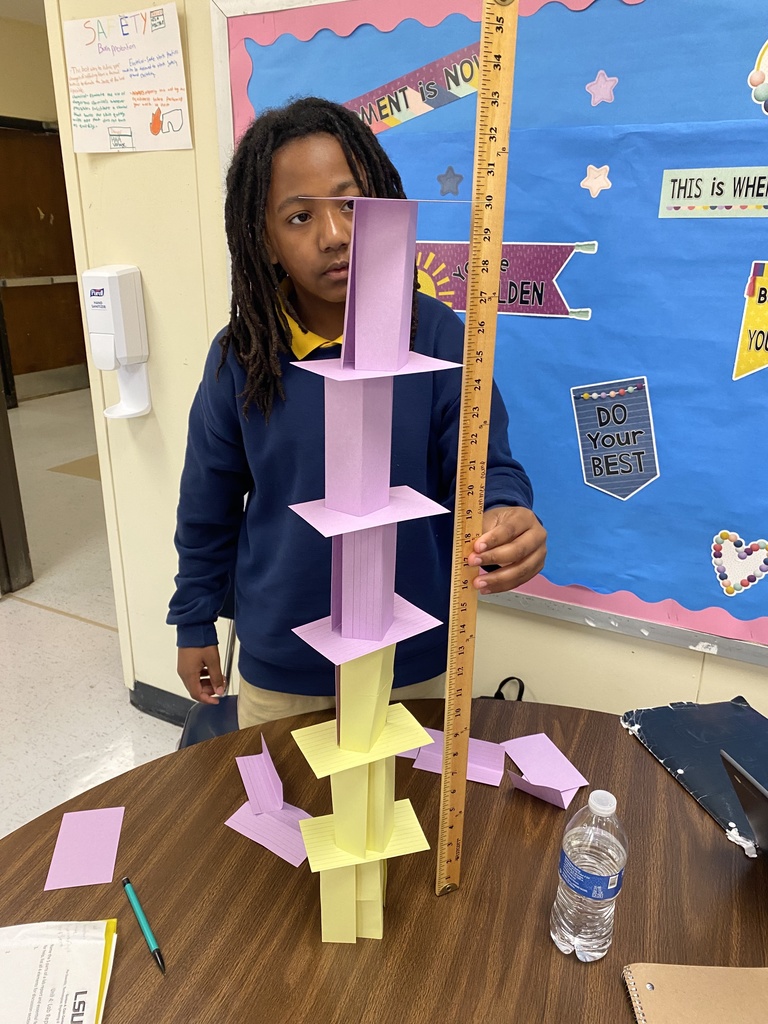 John Goudeau measures a free standing tower.